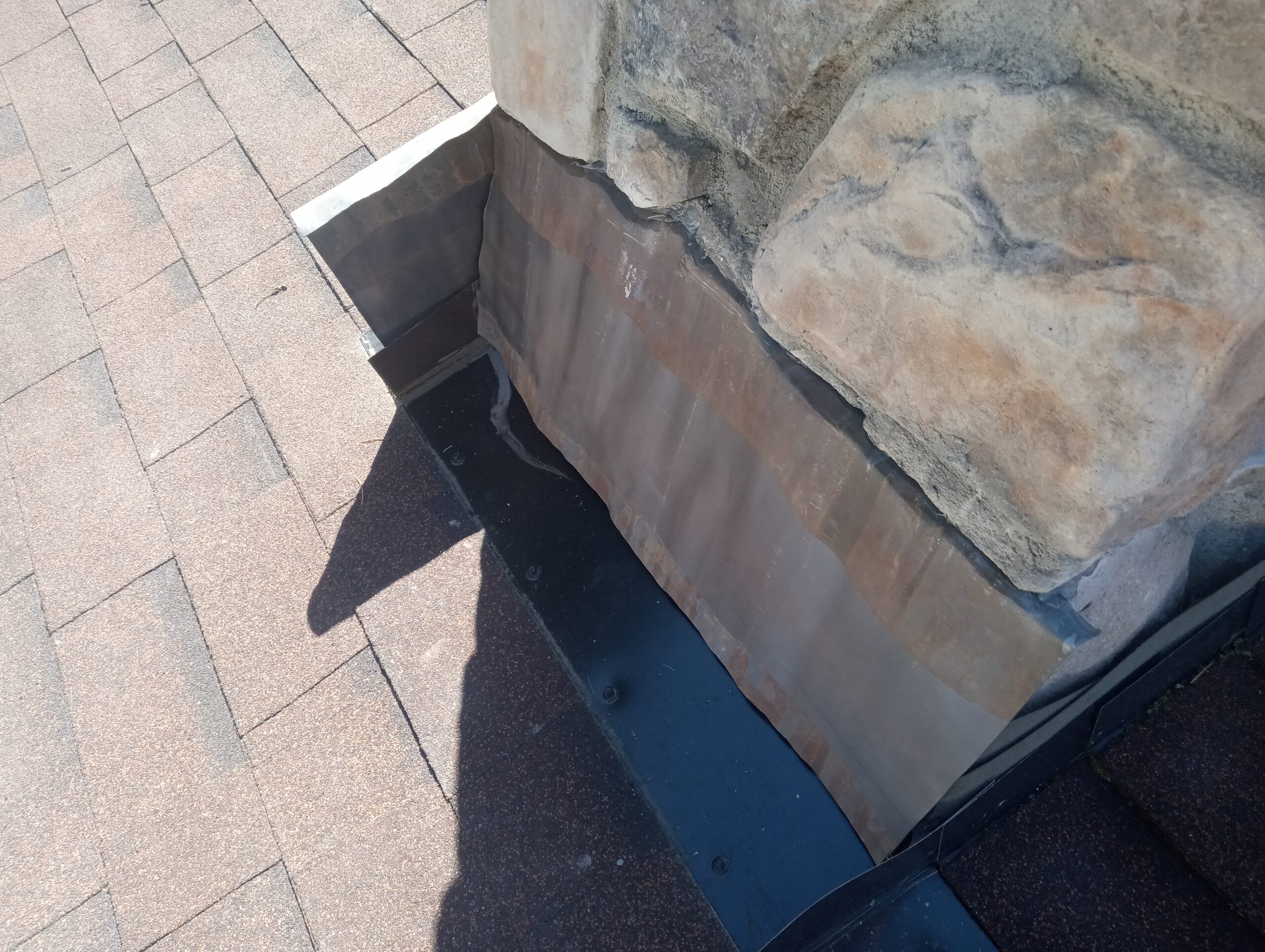 Chimney flashing being installed