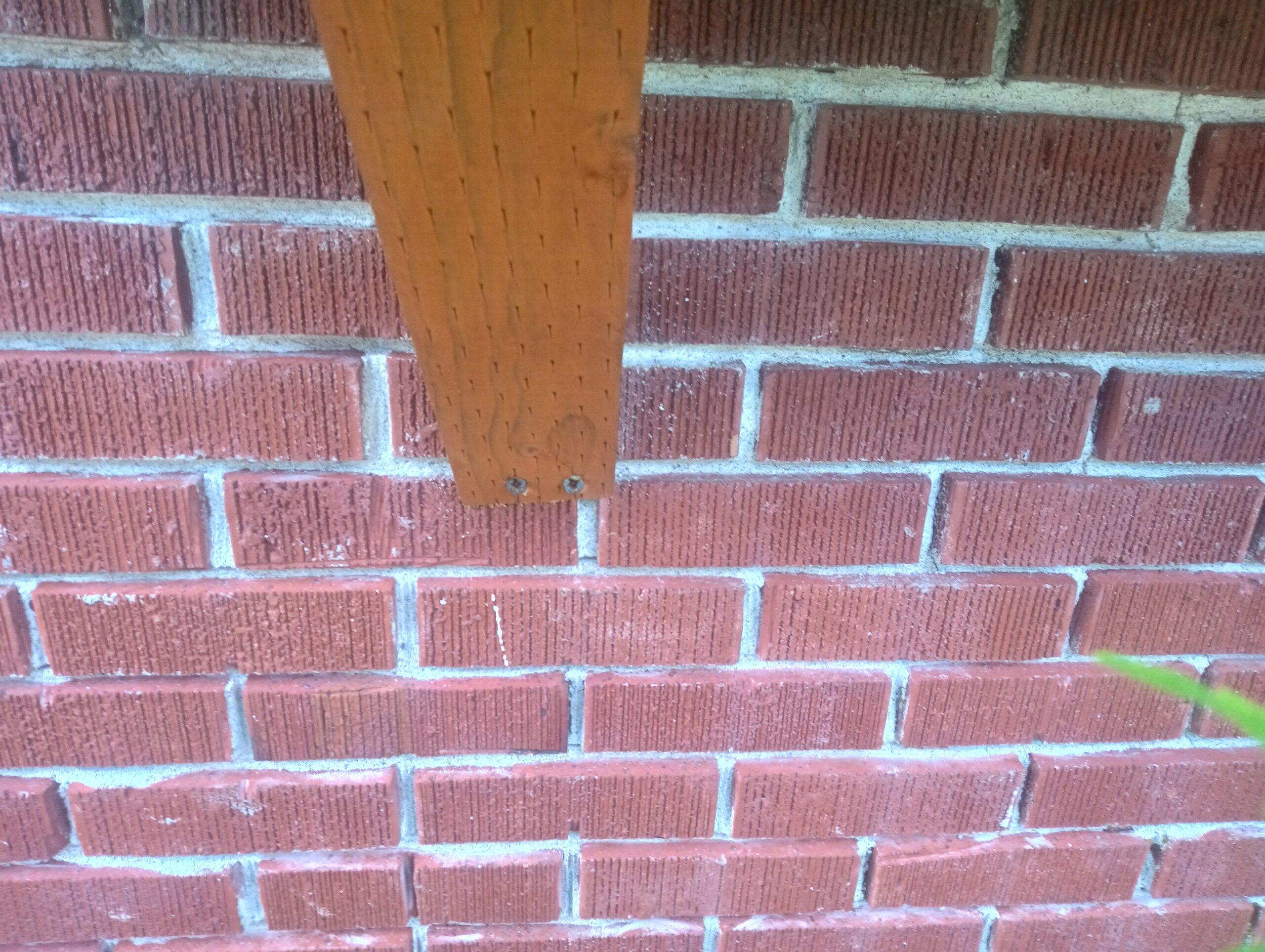 Worn mortar joints ground out at an 80 year-old house in Newberg, Oregon.