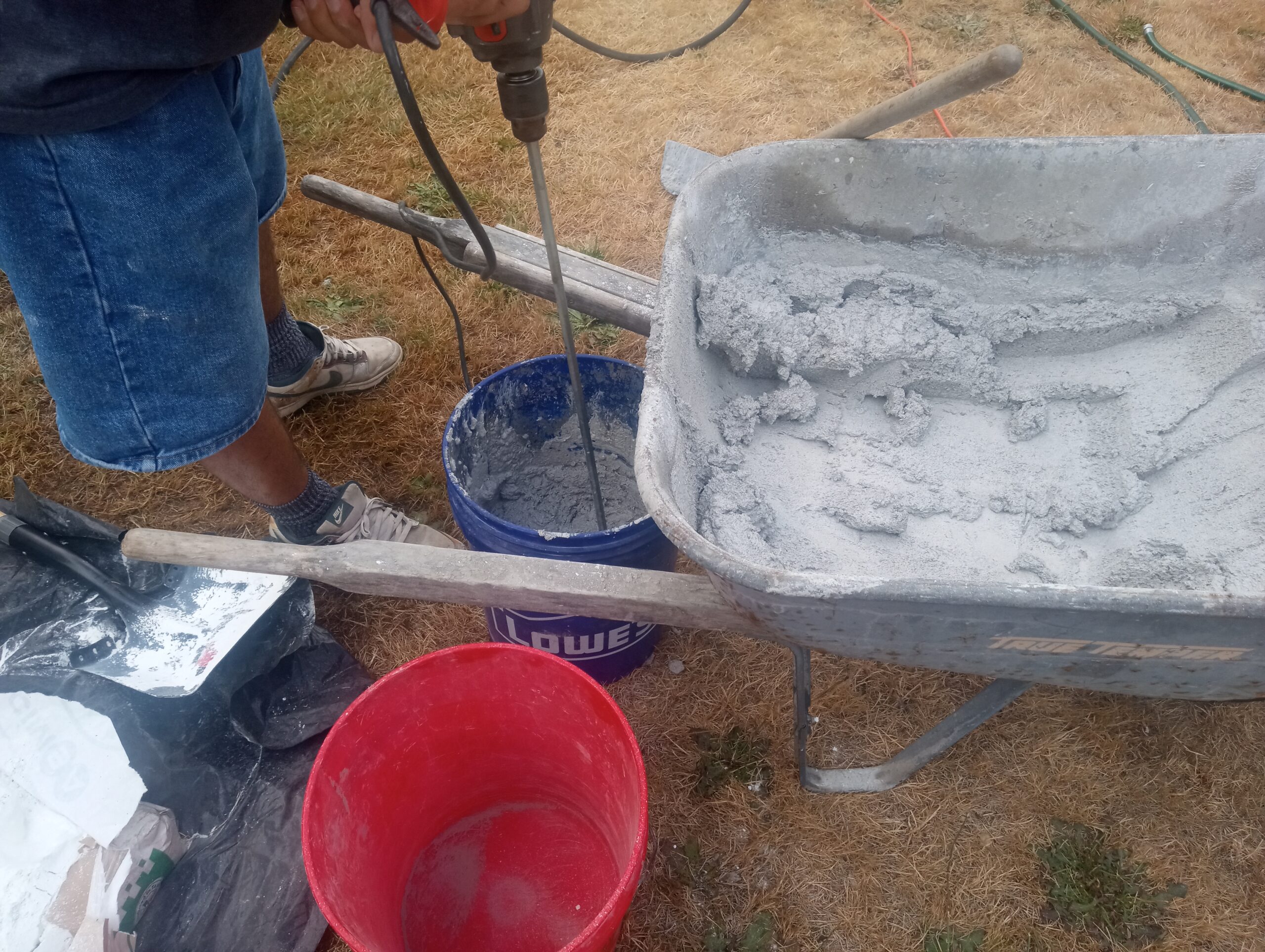 Mixing a custom made mix of lime, white cement and brown sand.